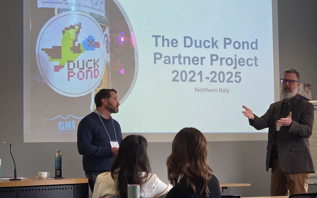 Kevin Dalton, Archaeologist and Terrestrial Development Lead with the Henry M. Jackson Foundation for the Advancement of Military Medicine in support of the Defense POW/MIA Accounting Agency, left, and Bryan Harrell, a member of SEARCH, a DPAA partner organization, discuss the Duck Pond mission during DPAA’s fourth annual Partnership Symposium at Cranfield University, Sept. 24, 2025.