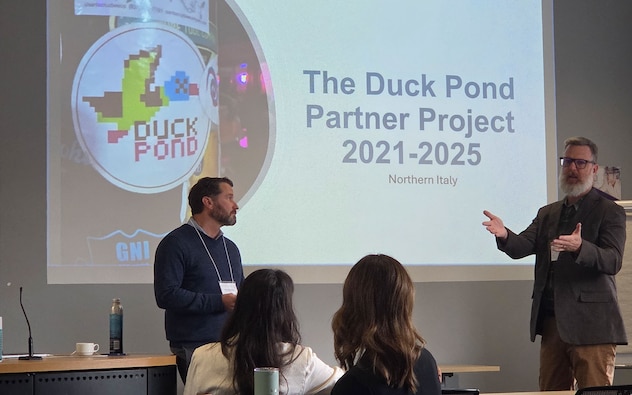 Kevin Dalton, Archaeologist and Terrestrial Development Lead with the Henry M. Jackson Foundation for the Advancement of Military Medicine in support of the Defense POW/MIA Accounting Agency, left, and Bryan Harrell, a member of SEARCH, a DPAA partner organization, discuss the Duck Pond mission during DPAA’s fourth annual Partnership Symposium at Cranfield University, Sept. 24, 2025.