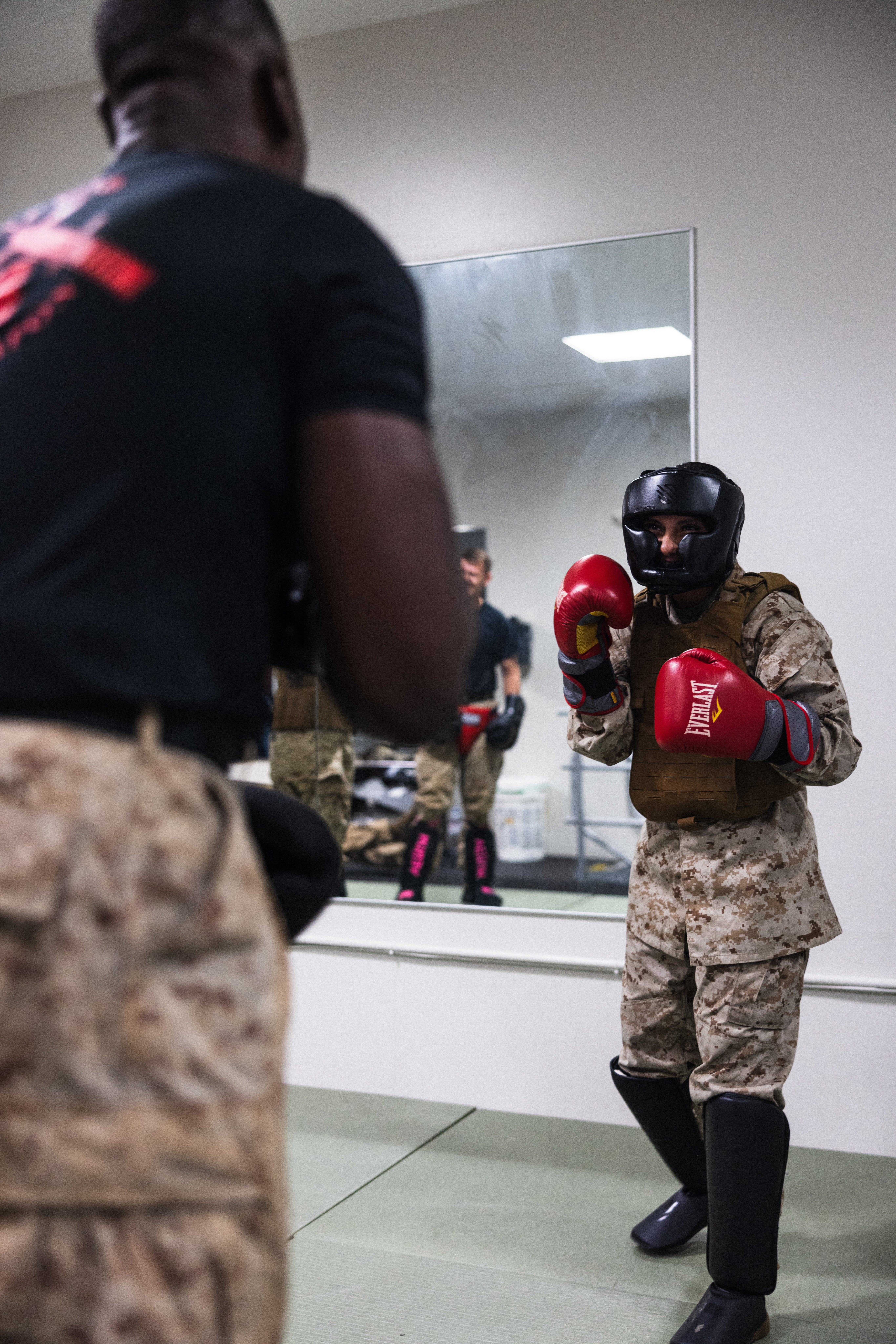 U.S. Marines with Marine Corps Base Camp Blaz participate in a standing and striking bout during a Marine Corps Martial Arts Program green belt advancement on MCB Camp Blaz, Guam, Nov. 26, 2025. MCMAP teaches Marines useful combat skills and implements a war fighting mindset. (U.S. Marine Corps photo by Sgt. Brayden Daniel)