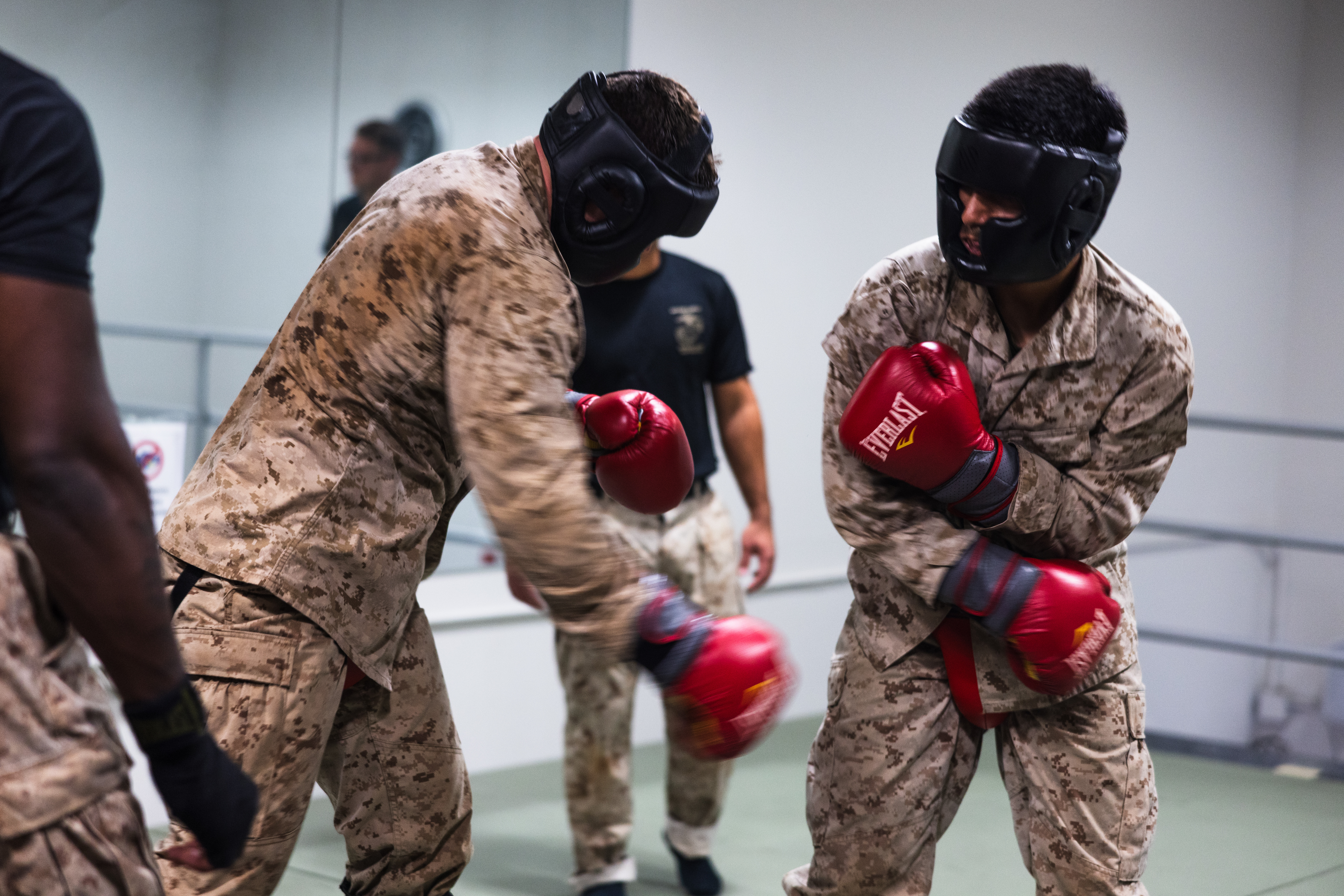 U.S. Marines with Marine Corps Base Camp Blaz participate in a standing and striking bout during a Marine Corps Martial Arts Program green belt advancement on MCB Camp Blaz, Guam, Nov. 26, 2025. MCMAP teaches Marines useful combat skills and implements a war fighting mindset. (U.S. Marine Corps photo by Sgt. Brayden Daniel)