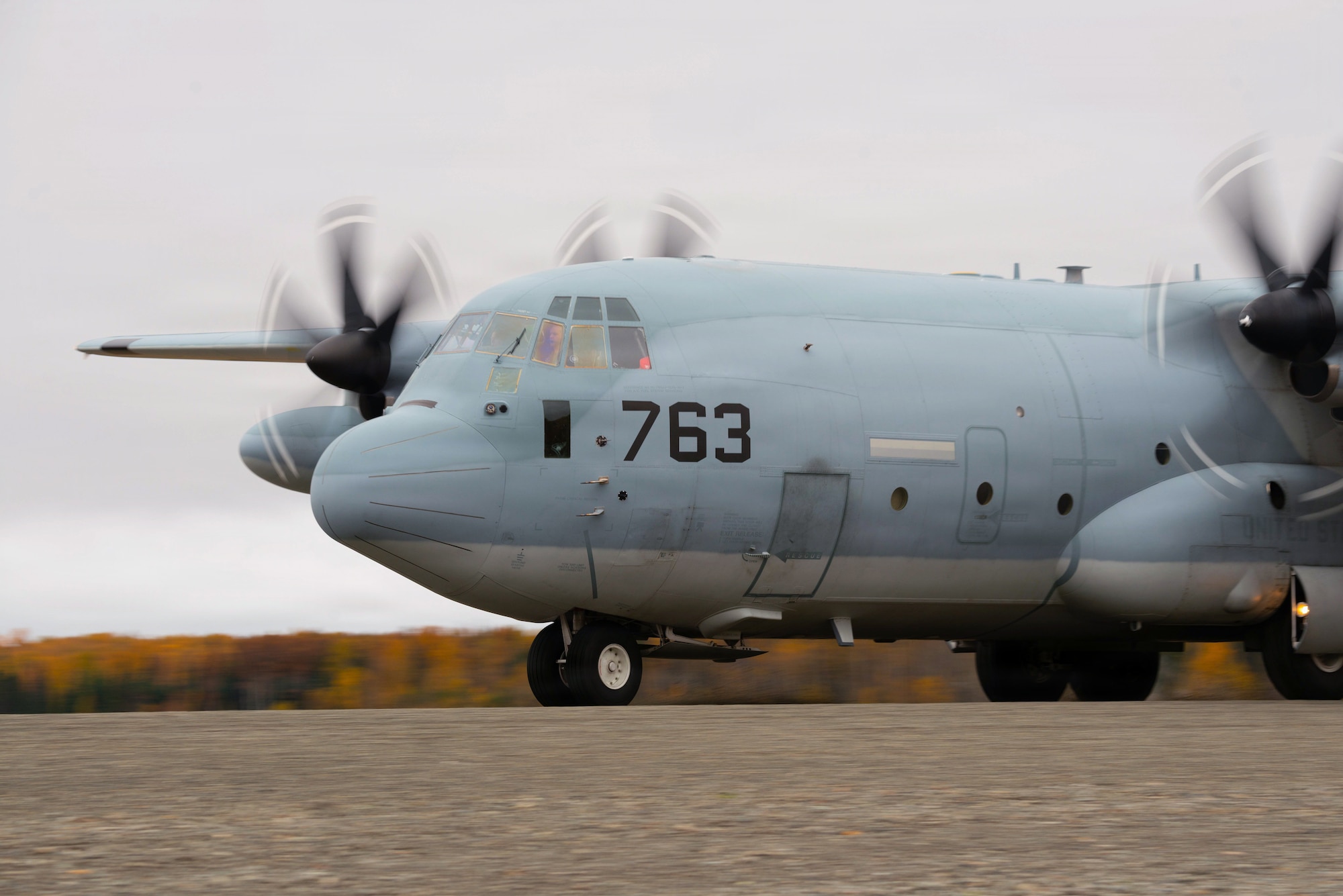A U.S. Marine Corps C-130 Hercules assigned to Marine Aerial Refueler Transport Squadron 234 (VMGR-234), lands on a flightline as a part of a landing exercise on Joint Base Elmendorf-Richardson, Alaska, Sept. 26, 2025. Marines from VMGR-234 are trained to land and load in austere environments to prepare themselves for real-world missions that may require operating in remote or unprepared locations. (U.S. Air Force photo by Airman Keola Vischi)