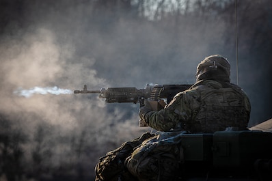 CAMP CASEY, South Korea (Dec. 4, 2025) — U.S. Army Staff Sgt. Zhiyuan Jiang, section chief, B Battery, 6-37 Field Artillery Regiment, 210 Field Artillery Brigade, fires 240B machine gun during a live fire exercise at Montana Range near Paju, South...