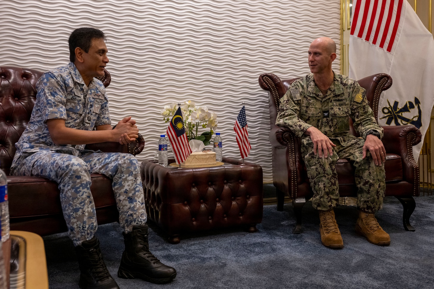 U.S. Navy Capt. Matt Cox, deputy commodore, Destroyer Squadron (DESRON) 7, speaks with Royal Malaysian Navy (RMN) Western Fleet Commander, Vice Adm. Dato’ Baharudin bin Wan Md Nor, during an office call for Cooperation Afloat Readiness and Training (CARAT) Malaysia 2025 at Lumut Naval Base, in Lumut, Malaysia, Dec. 4, 2025. This year marks the 31st iteration of CARAT, a multinational exercise series designed to enhance U.S. and partner navies' abilities to operate together in response to traditional and nontraditional maritime security challenges in the Indo-Pacific region. (U.S. Navy photo by Mass Communication Specialist 2nd Class Anthony Robledo)