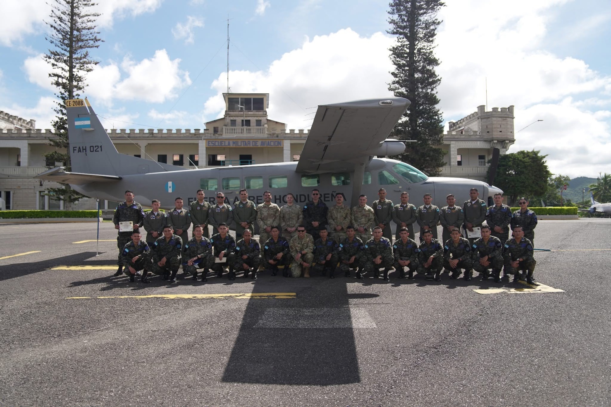 People stand with plane.