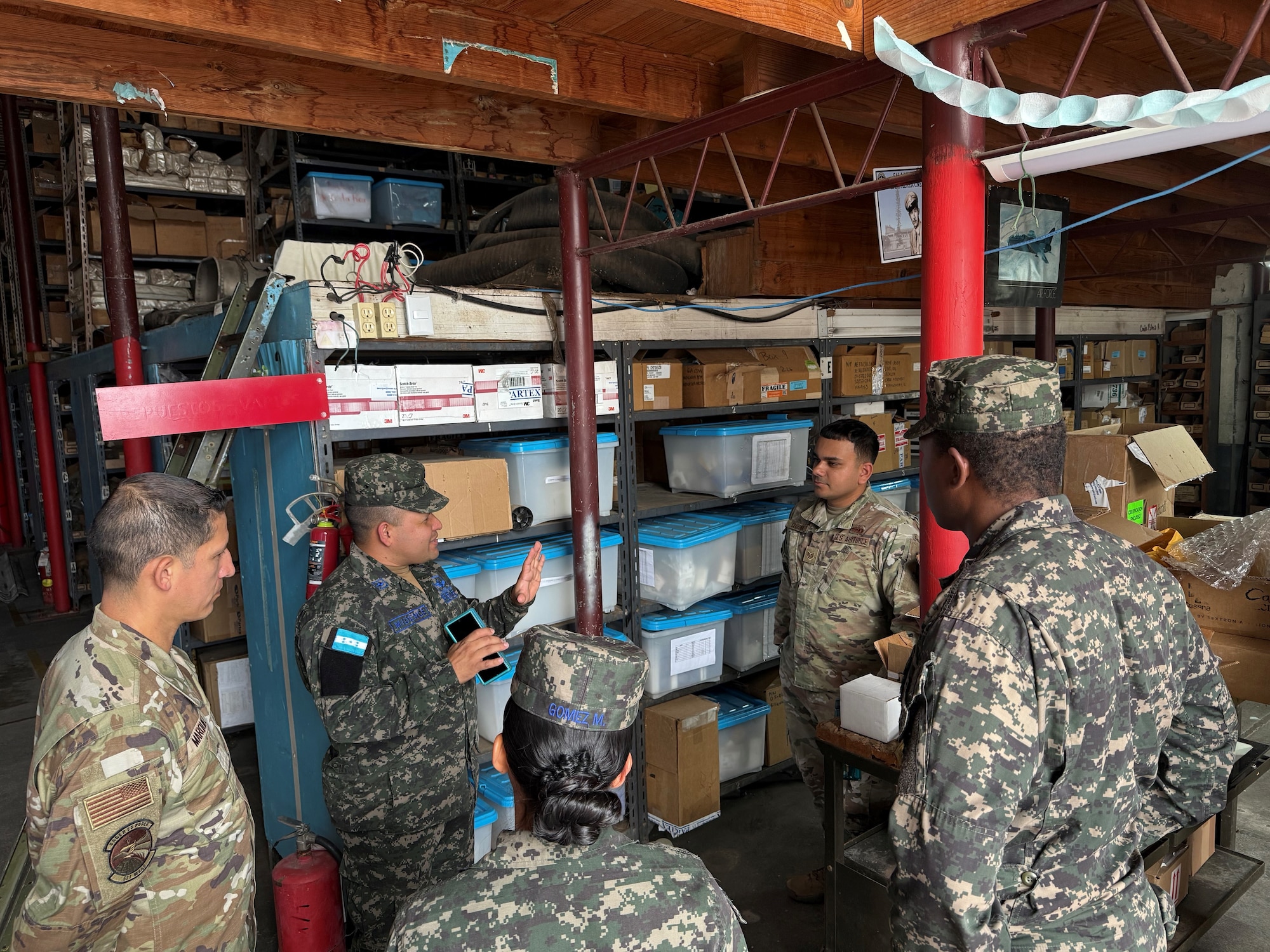 People speak in a warehouse.