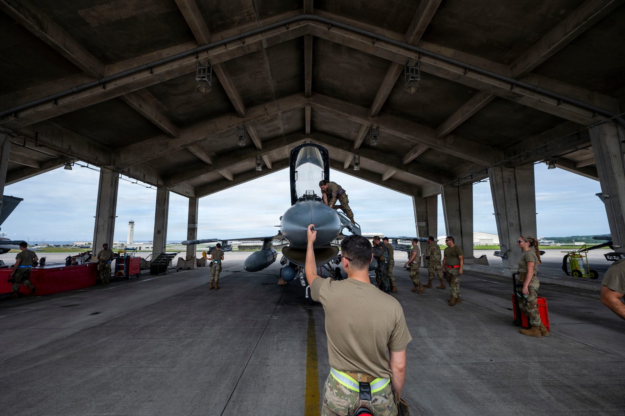 U.S. Air Force 119th Expeditionary Fighter Generation Squadron maintainers conduct post flight checks on an F-16C Fighting Falcon assigned to the 119th Expeditionary Fighter Squadron, Atlantic City Air National Guard Base, New Jersey, after landing at Kadena Air Base, Japan, Oct. 23, 2025.