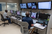 Ibrahim Conteh, left, centrifuge operations supervisor, and Sawyer Mitchell, NASA test conductor, speak to European Space Agency astronaut Sophie Adenot from the control room as she trains in the 711th Human Performance Wing’s centrifuge at Wright-Patterson Air Force Base, Ohio, June 20, 2025. Five astronauts from NASA, ESA and the Canadian Space Agency completed centrifuge training, which simulates gravitational forces, or g-forces, experienced during launch and return to Earth. (U.S. Air Force photo / Richard Eldridge)