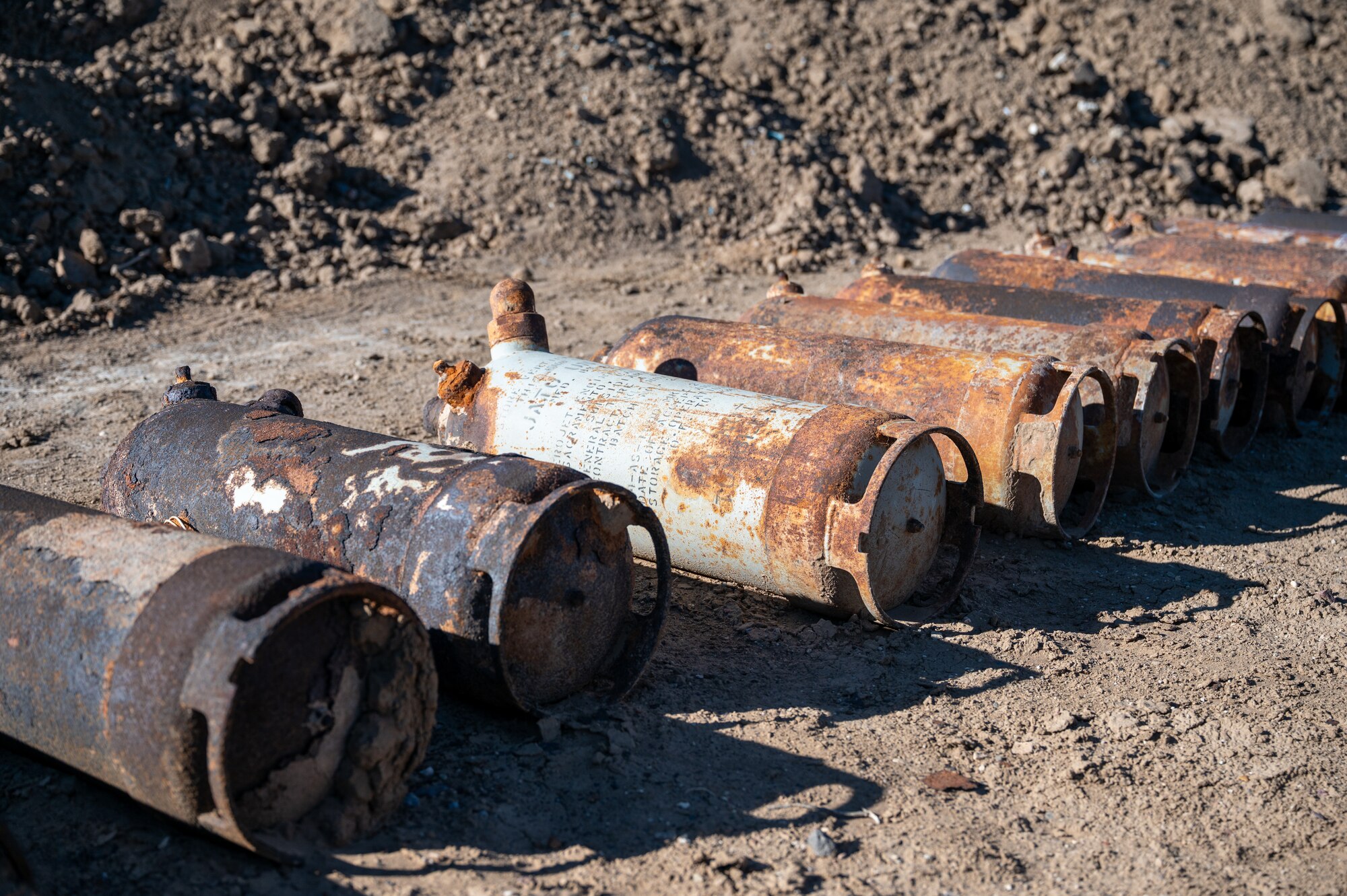 Unexploded and deteriorated training ordnance rests on the ground during a joint cleanup effort on the Isleta Pueblo, N.M., Oct. 16. The 377th Explosive Ordnance Disposal Flight worked with Pueblo officials to identify, remove, and safely dispose of munitions left behind from a former bomber training range. (U.S. Air Force photo by Senior Airman Donnell Schroeter)