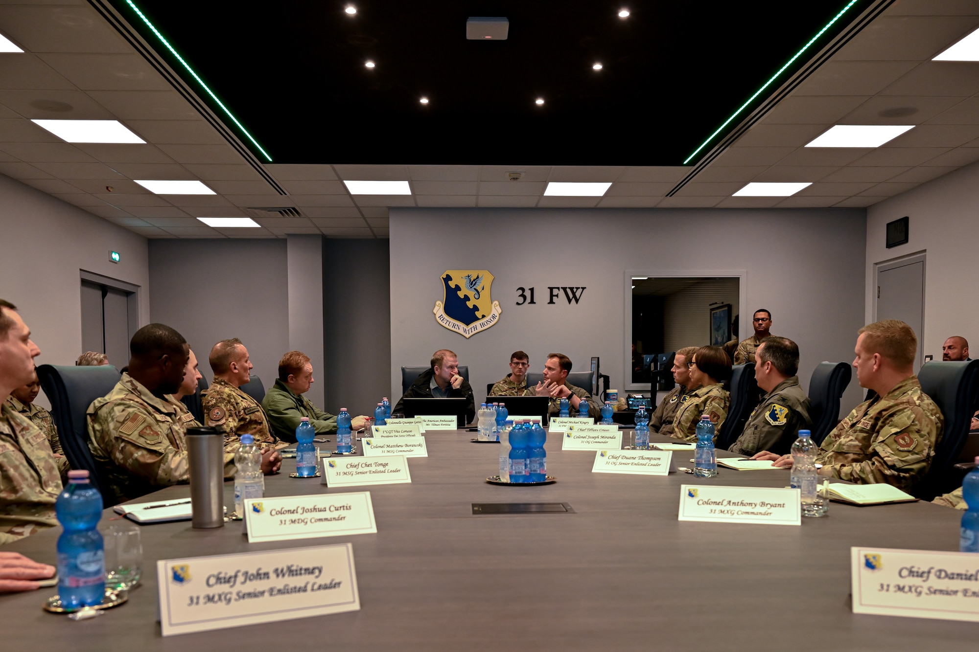 Air Force leaders speak with the Honorable Tilman J. Fertitta, U.S. Ambassador to Italy during a meeting.