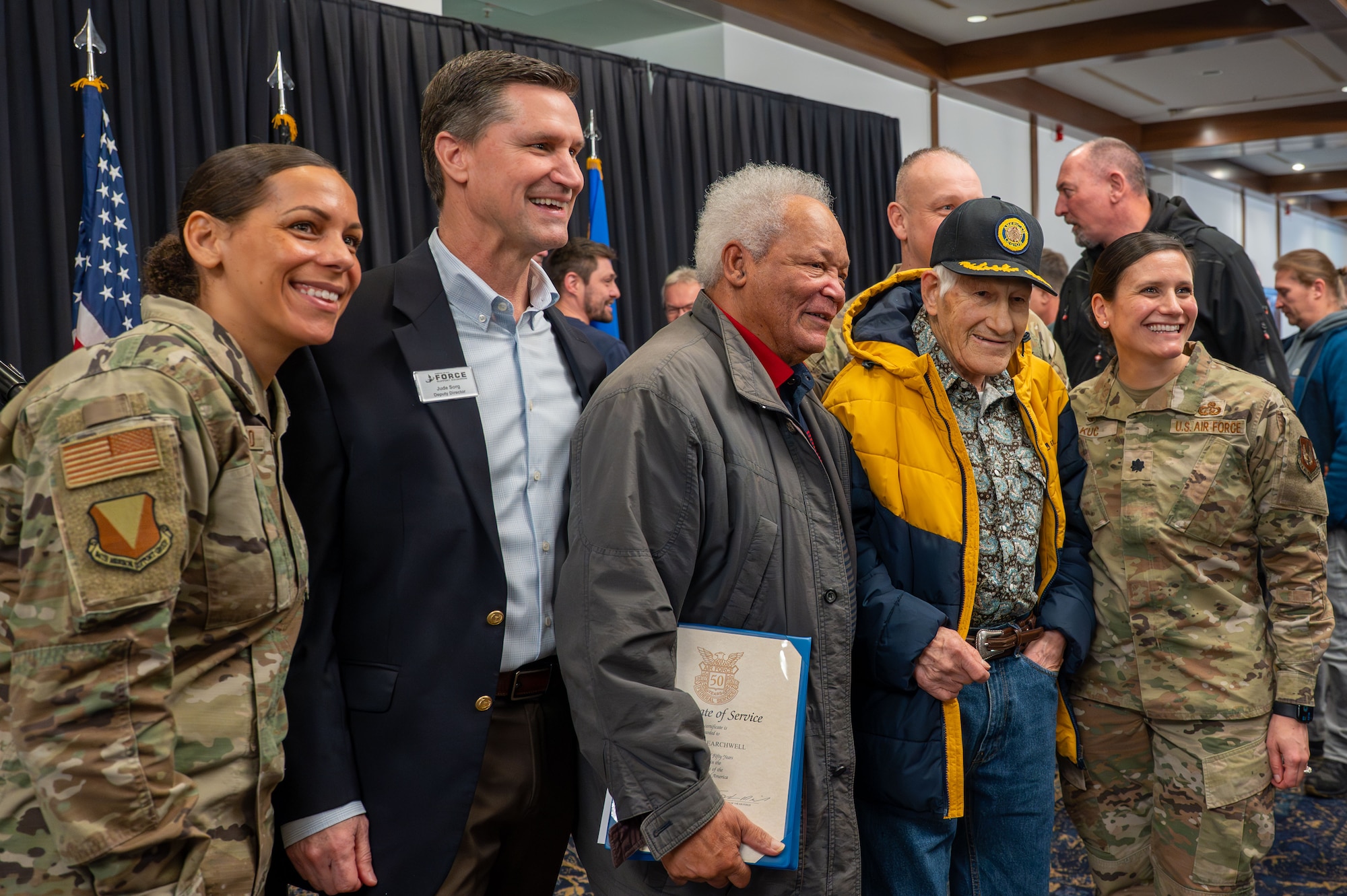 Local national awarded at the Length of Service ceremony.
