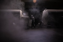 Airman checking tanks