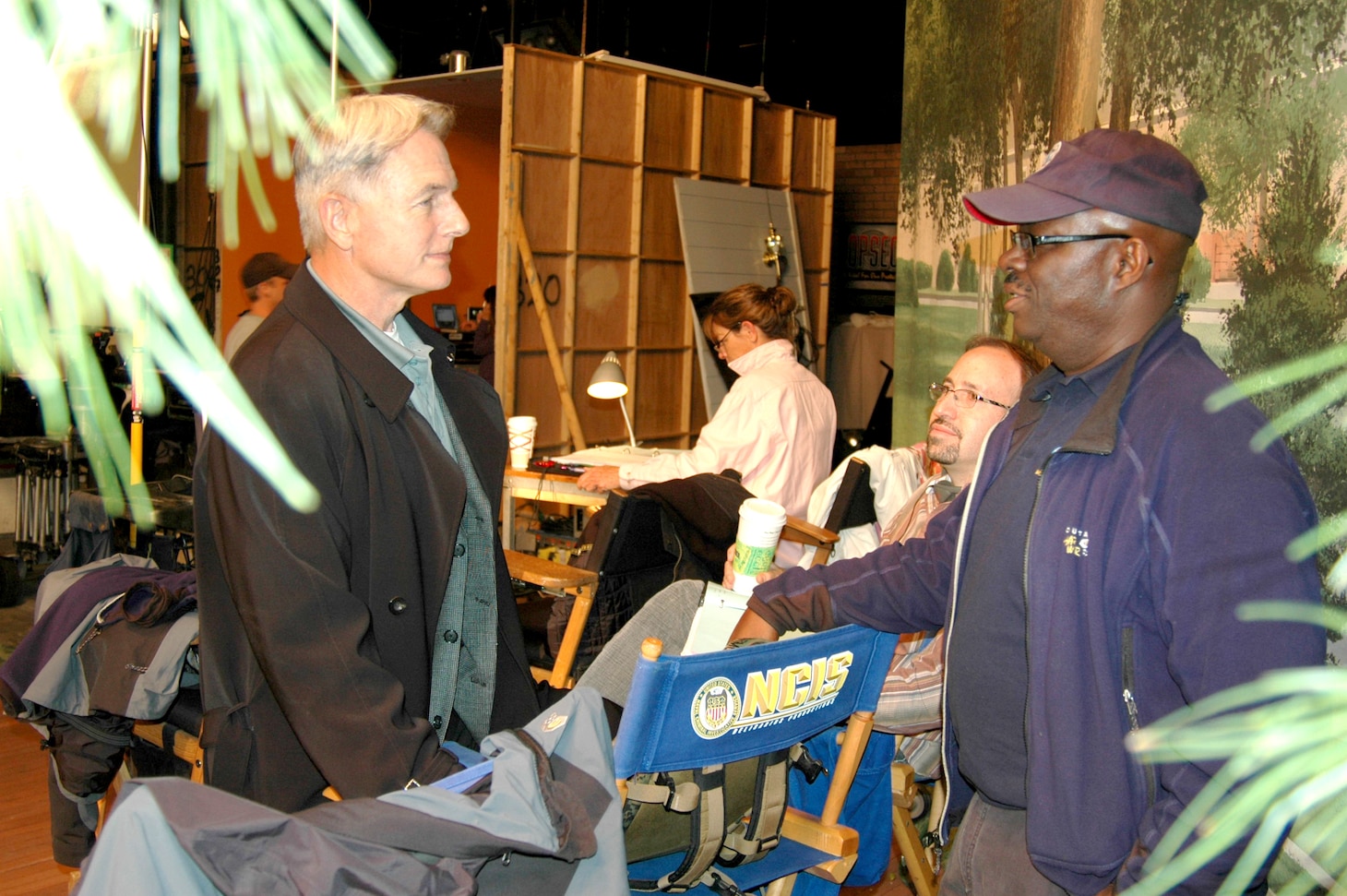 Actor Mark Harmon, left, and Leon Carroll, Jr. interact on the set of CBS' "NCIS" television series. Carroll was the shows technical advisor.