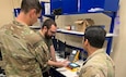 Radames Feliciano, center, a biomedical equipment technician with the U.S. Army Medical Materiel Agency, works with medics from 2nd Brigade, 82nd Airborne Division, to inventory medical equipment at the new Home-Station Medical Maintenance Support shop at Fort Bragg, N.C.