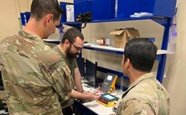 Radames Feliciano, center, a biomedical equipment technician with the U.S. Army Medical Materiel Agency, works with medics from 2nd Brigade, 82nd Airborne Division, to inventory medical equipment at the new Home-Station Medical Maintenance Support shop at Fort Bragg, N.C.