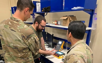 Radames Feliciano, center, a biomedical equipment technician with the U.S. Army Medical Materiel Agency, works with medics from 2nd Brigade, 82nd Airborne Division, to inventory medical equipment at the new Home-Station Medical Maintenance Support shop at Fort Bragg, N.C.