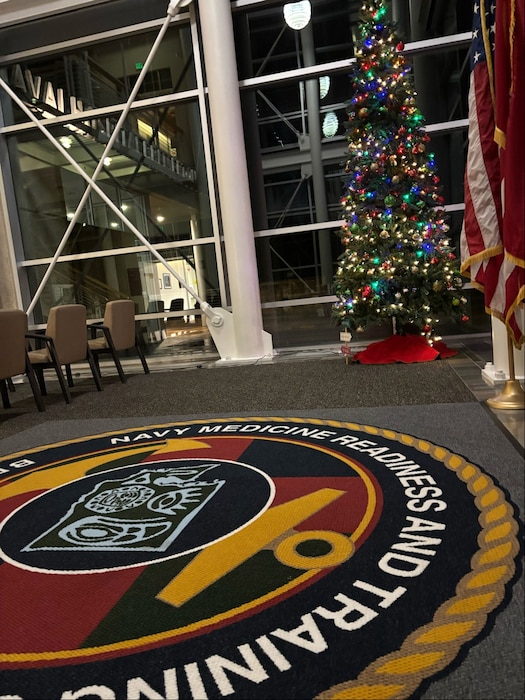 Keeping the Light on...The annual tradition of keeping a symbolic light on for those deployed over the holidays continued at Naval Hospital Bremerton, December 2, 2025. From the Far East to the Horn of Africa to jungles of Southeast Asia, NHB’s tree lighting ceremony provided the opportunity for staff to remember those deployed, as well as reflect on their commitment to being a ready medical force ensuring the Navy fleet is a medically ready force. The tree will remain lit throughout the holiday season, leaving a continuous light on for those still deployed and helping others in need (official Navy photo by Douglas H Stutz, NHB/NMRTC Bremerton public affairs officer).