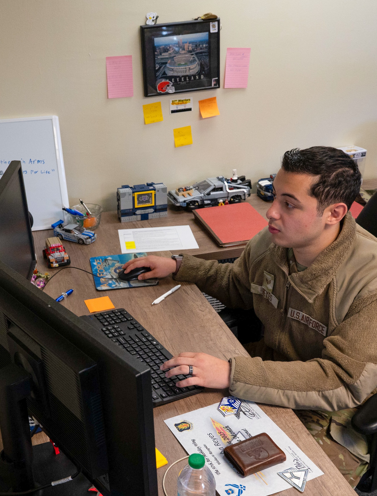 U.S. Air Force Senior Airman Joshua Reyes, 97th Air Mobility Wing Chapel Office religious affairs airman, works at his desk at Altus Air Force Base, Oklahoma, Sept. 29, 2025. Reyes was awarded Airman of the Month for August with his commitment to take on higher responsibilities within the unit.(U.S. Air Force photo by Tech. Sgt. Hailey Haux)