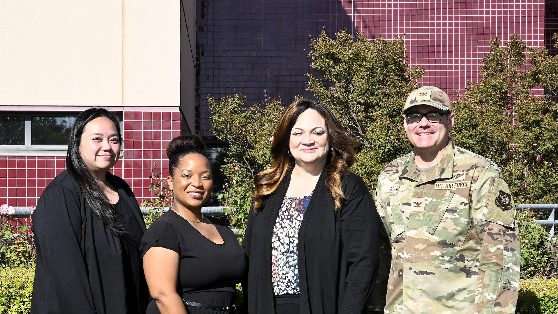 (From left) Valerie Roldan, Regina Barlow, Constance Smith, and Col. (Dr.) John Allis pose for a group photo outside David Grant Medical Center at Travis Air Force Base, California, Dec. 2, 2025. Roldan and Barlow are registered nurses and surgical clinical reviewers. Smith serves as the Lead Surgical Clinical Nurse Reviewer for the Air Force and represents the Air Force on the DoD DHA NSQIP Steering Panel. Allis is an orthopedic surgeon assigned to the 60th Medical Group.