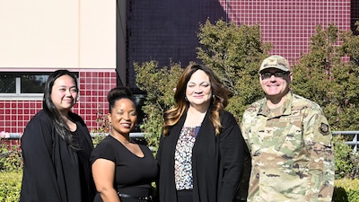 (From left) Valerie Roldan, Regina Barlow, Constance Smith, and Col. (Dr.) John Allis pose for a group photo outside David Grant Medical Center at Travis Air Force Base, California, Dec. 2, 2025. Roldan and Barlow are registered nurses and surgical clinical reviewers. Smith serves as the Lead Surgical Clinical Nurse Reviewer for the Air Force and represents the Air Force on the DoD DHA NSQIP Steering Panel. Allis is an orthopedic surgeon assigned to the 60th Medical Group.