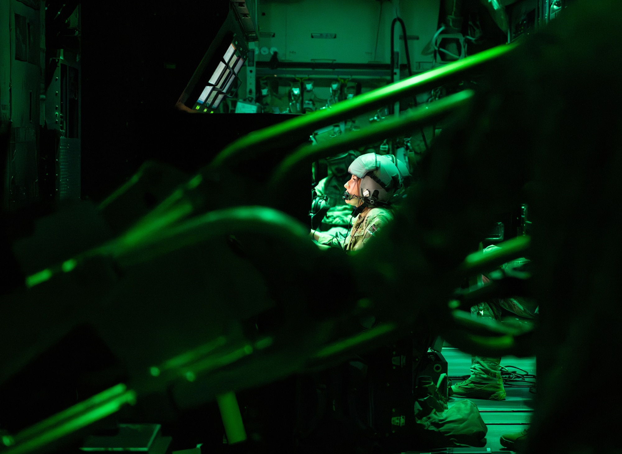 A U.S. Air Force AC-130J Ghostrider gunship weapons systems operator assigned to the 1st Special Operations Wing scans for targets above a range near Hurlburt Field, Florida, Nov. 12, 2025.
