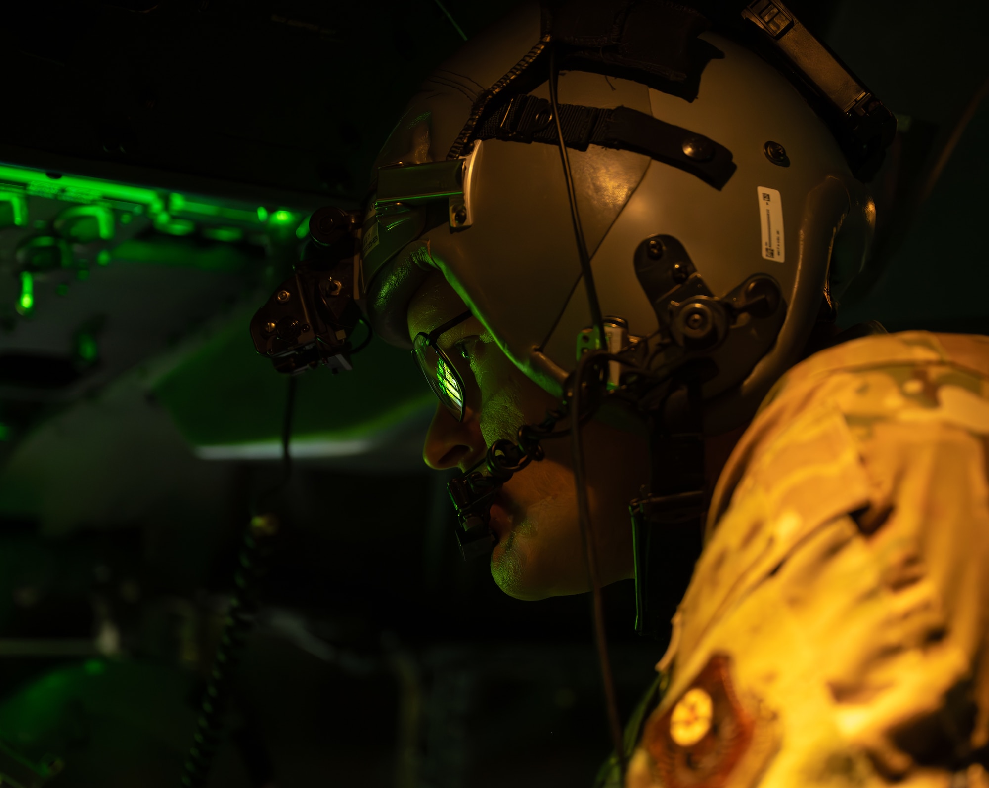 A U.S. Air Force AC-130J Ghostrider gunship pilot assigned to the 1st Special Operations Wing monitors flight deck controls above northwest Florida, Nov. 12, 2025.