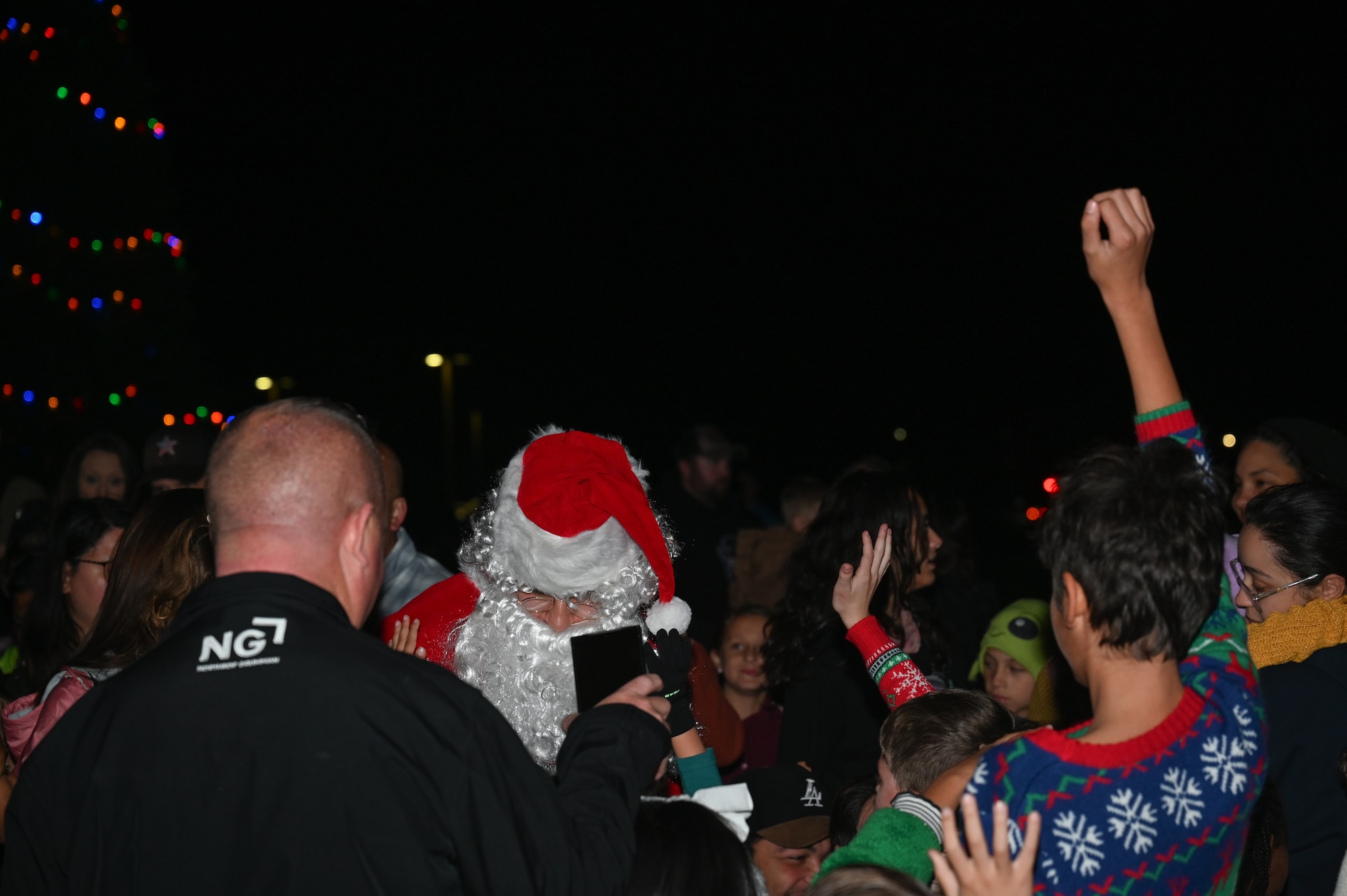 Santa Claus visits with children during the Holiday Tree Lighting Ceremony held at Vandenberg Space Force Base.