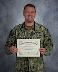 GULFPORT, Miss. (Dec. 5, 2025) Chief Hospital Corpsman Christopher Marlo, assigned to Naval Mobile Construction Battalion (NMCB) 11, stands for a portrait at Naval Construction Battalion Center Gulfport, Mississippi, Dec. 5, 2025 with his Licensed Practical Nurse certificate. Chief Marlo recently passed the NCLEX on his first attempt following new Mississippi legislation that allows Hospital Corpsmen to obtain Licensed Practical Nurse credentials. NMCB 11, assigned to Naval Construction Group TWO, is homeported in Gulfport, Miss. as part of the Naval Construction Force. (U.S. Navy photo by MC2 Alexa H. Trafton)
