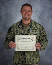 GULFPORT, Miss. (Dec. 5, 2025) Chief Hospital Corpsman Christopher Marlo, assigned to Naval Mobile Construction Battalion (NMCB) 11, stands for a portrait at Naval Construction Battalion Center Gulfport, Mississippi, Dec. 5, 2025 with his Licensed Practical Nurse certificate. Chief Marlo recently passed the NCLEX on his first attempt following new Mississippi legislation that allows Hospital Corpsmen to obtain Licensed Practical Nurse credentials. NMCB 11, assigned to Naval Construction Group TWO, is homeported in Gulfport, Miss. as part of the Naval Construction Force. (U.S. Navy photo by MC2 Alexa H. Trafton)