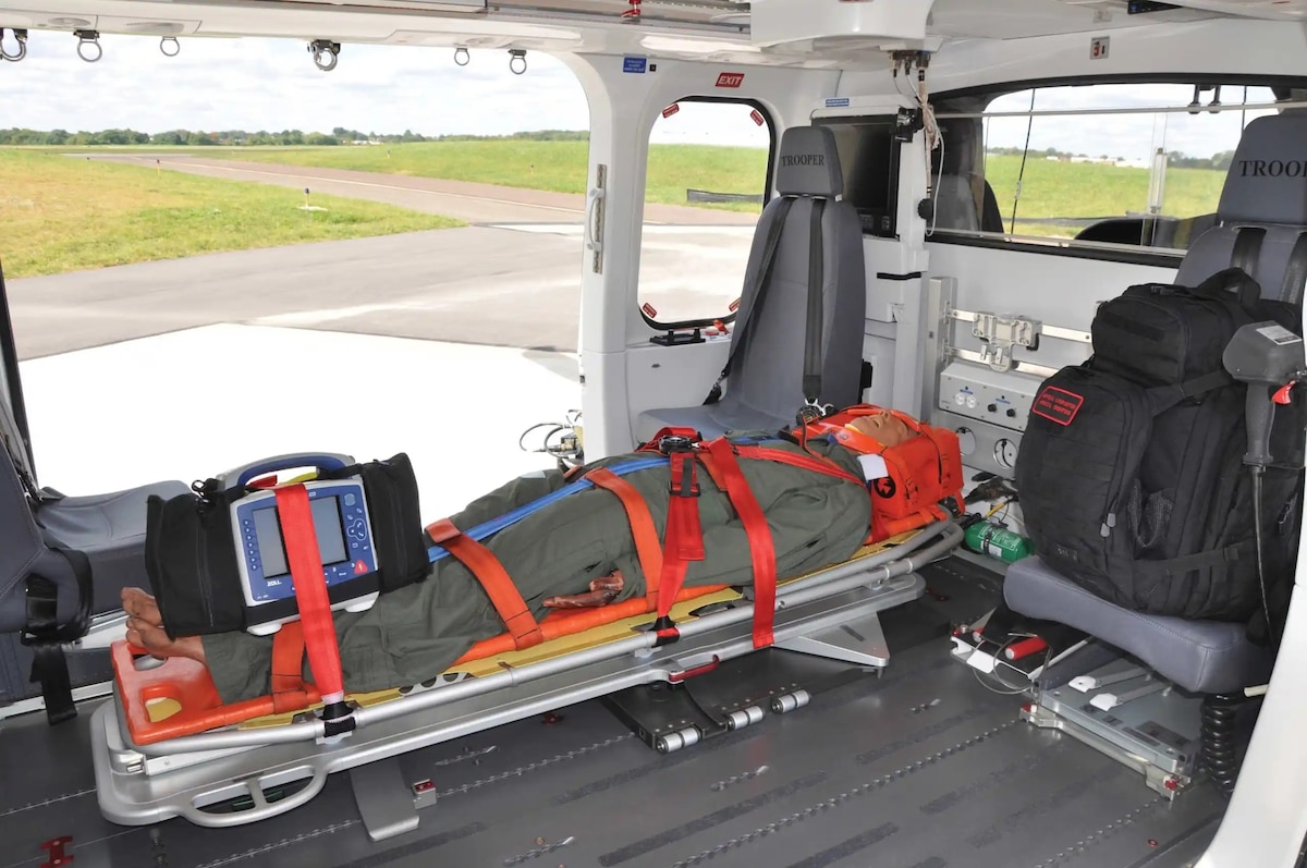 Image of a simulated patient in a helicopter.