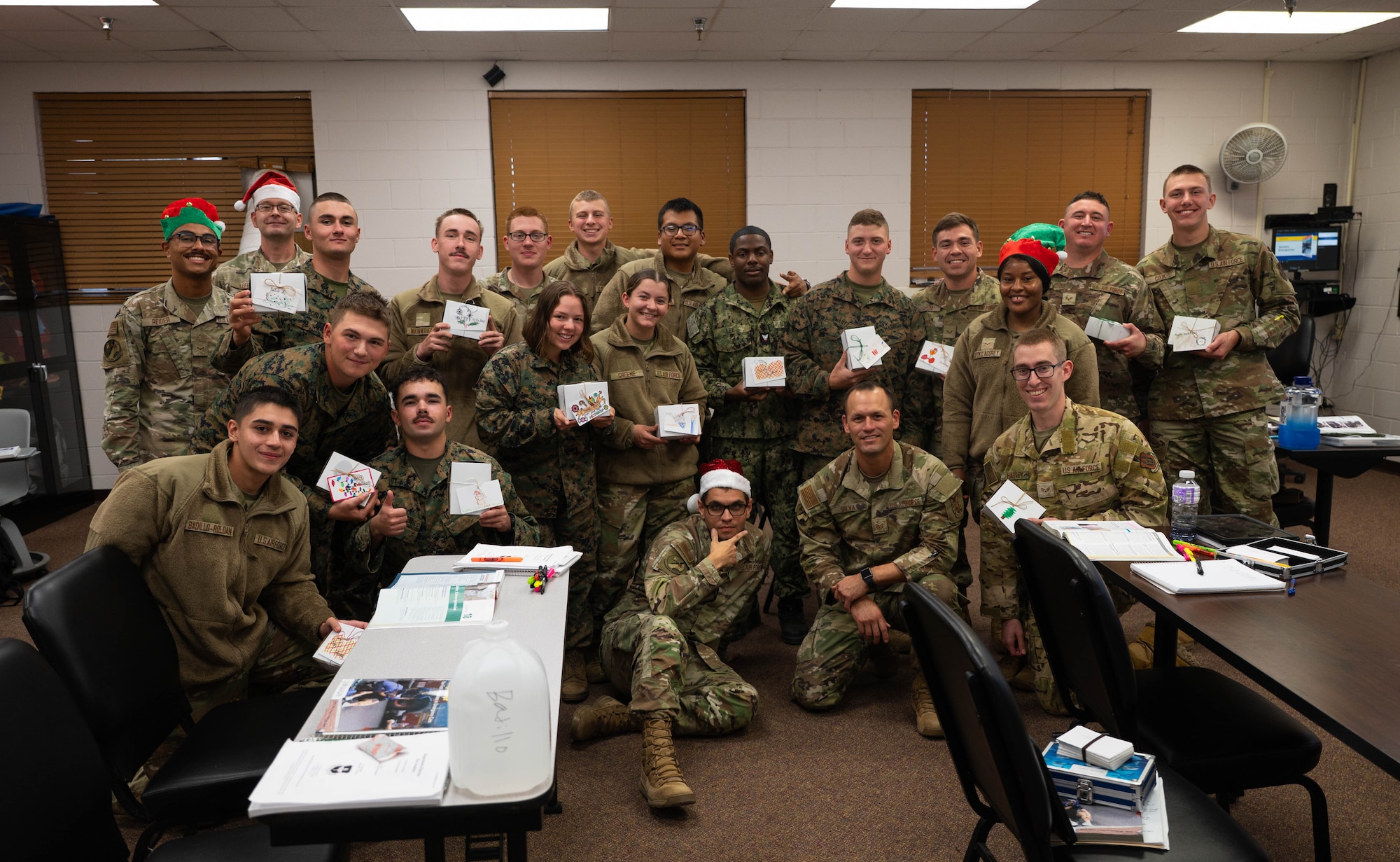 Students attached to the 312th Training Squadron receive holiday cookies at Goodfellow Air Force Base, Texas, Dec. 4, 2025. The annual cookie caper event, with the contribution of the San Angelo community and Goodfellow leadership, shows students appreciation by gifting them cookies with handwritten cards for the holiday season. (U.S. Air Force photo by Airman 1st Class Maria Mota)
