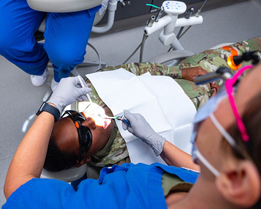 U.S. Air Force Maj. Jessica Smith, 56th Medical Support Squadron general dentist, cleans a patient's teeth, Nov. 20, 2025, at Luke Air Force Base, Arizona.
