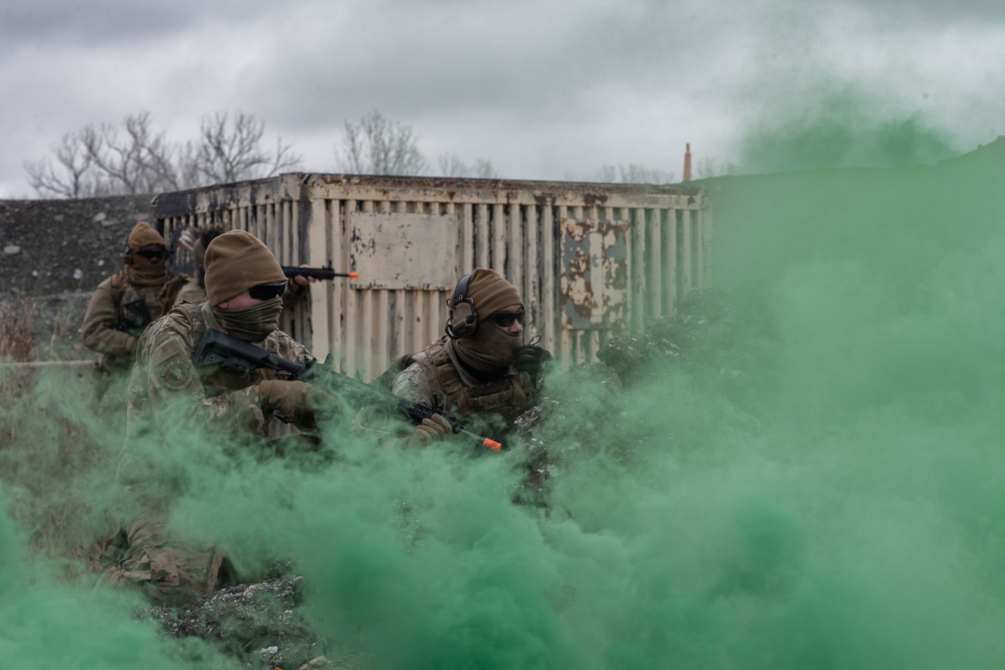 A 22nd Security Forces Squadron Airmen prepare to advance during a Mount Village training exercise at McConnell Air Force Base, Kansas, Nov. 21, 2025. Mount Village is used to practice team coordination and execution in a controlled urban environment. (U.S. Air Force photo by Senior Airman Paula Arce)