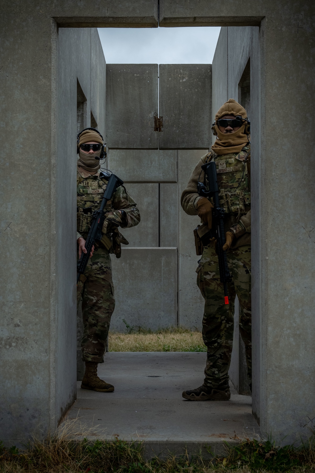 22nd Security Forces Squadron Airmen pose for a photo during a Mount Village training exercise at McConnell Air Force Base, Kansas, Nov. 21, 2025. Mount Village is a simulated urban location designed to practice team coordination and execution in a controlled environment. (U.S. Air Force photo by Senior Airman Paula Arce)