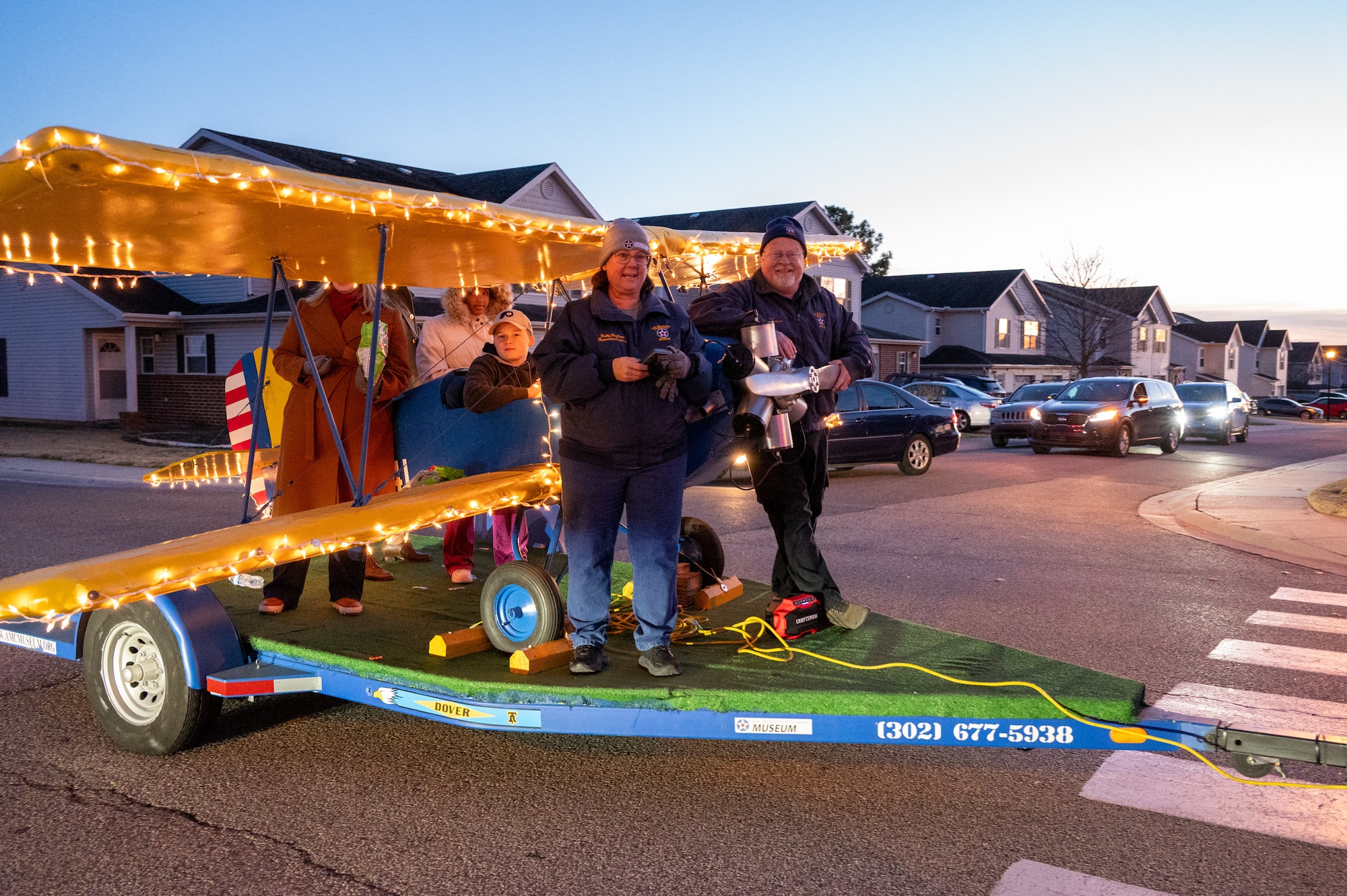 Air Mobility Command Museum staff and volunteers ride a float during the annual holiday parade at Dover Air Force Base, Delaware, Dec. 1, 2025. The parade is a Team Dover tradition and is followed by a tree lighting celebration. (U.S. Air Force photo by Mauricio Campino)