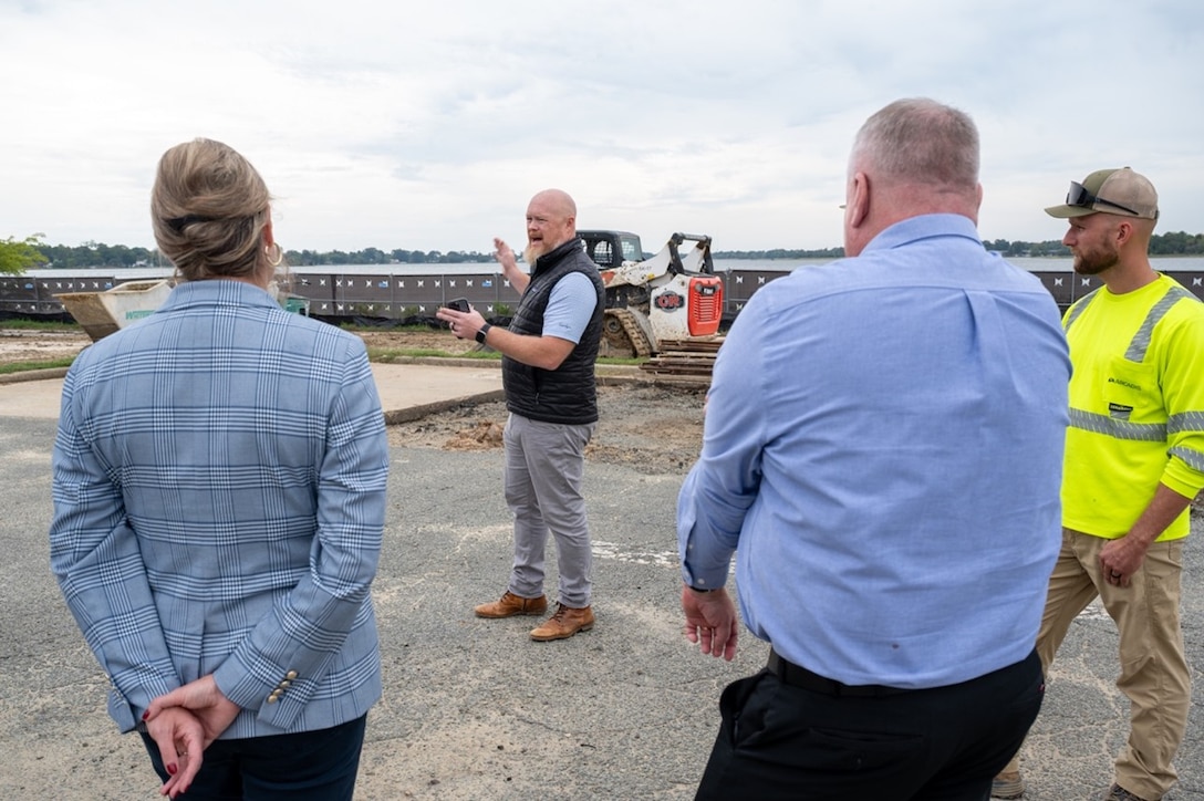 A civilian talks about land to other civilians. (U.S. Air Force photo by Airman 1st Class Donnell Ramsey)