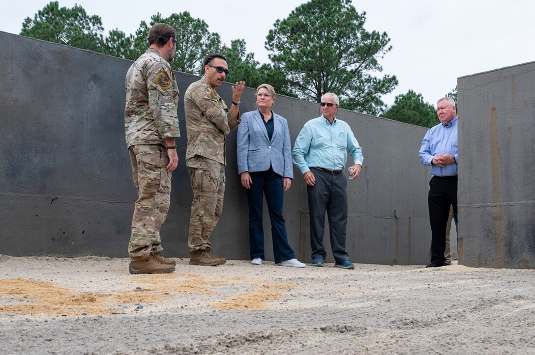 Airmen talk to civilians in a landfill. (U.S. Air Force photo by Airman 1st Class Donnell Ramsey)