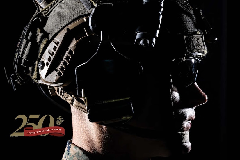 The profile of a Marine wearing a helmet on a black background.