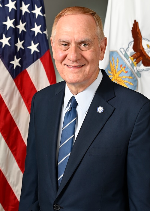 A civilian stands for portrait.