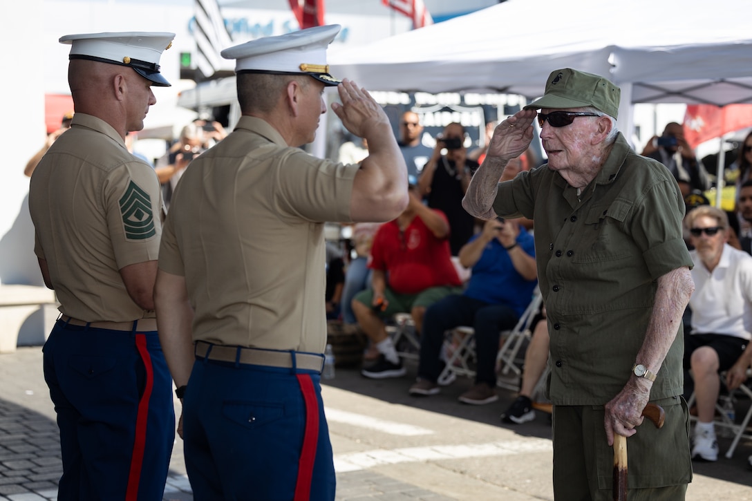 U.S. Marine Corps 1st Sgt. Poldoski, left, a first sergeant with Combat Logistics Battalion 23, 4th Marine Logistics Group; Col. Govea, middle, the chief of staff for Marine Corps Installations West; and Sgt. Wright, retired, a World War II and Iwo Jima veteran, render a salute during a promotion ceremony (honorary) in Stockton, California, Aug. 31, 2025. Wright enlisted on Jan. 21, 1942, at just 16 years old by using his older brother’s birthdate. He joined the 4th Marine Raiders and later fought in the battles of New Georgia, Guam, and Iwo Jima, where he was wounded and subsequently medically evacuated. After the war, he served as a drill instructor before being honorably discharged in January 1946. Wright went on to earn a business degree and built a career as a business consultant. His recent honorary promotion to sergeant recognizes his service and sacrifice during World War II as well as decades of community contributions. (U.S. Marine Corps photo by Sgt. Fourmet Gustavsen)