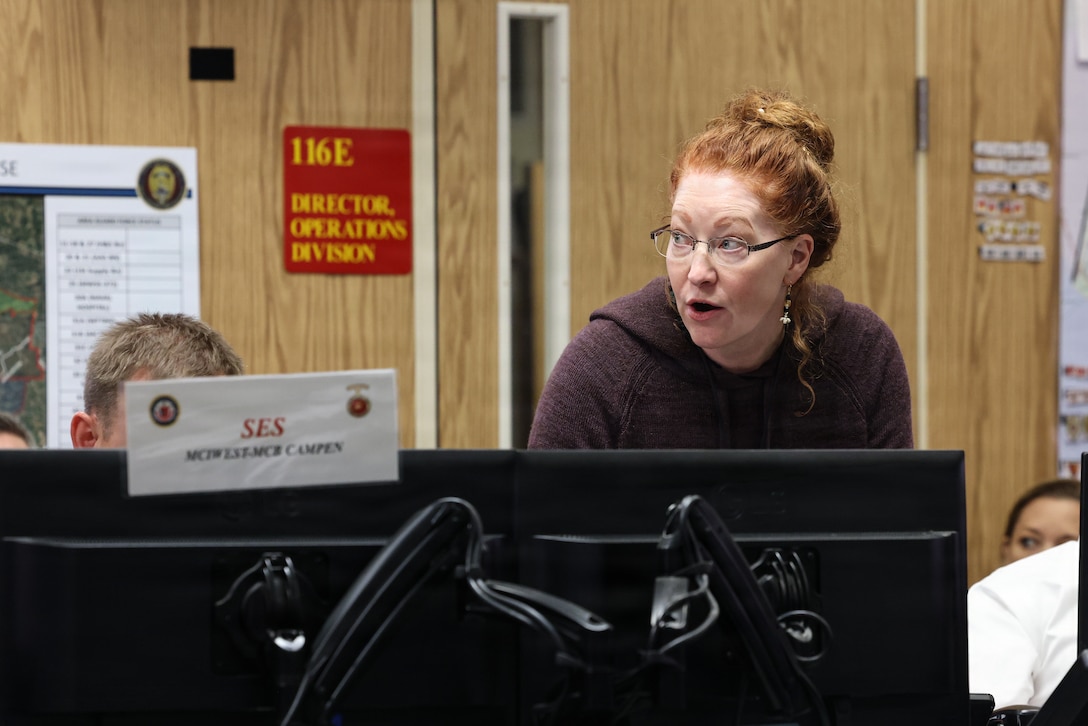 Ms. Hollenbeck, an emergency planning manager with Defense Coordinating Element IX, gives remarks during an Interagency Table Talk Exercise at Marine Corps Base Camp Pendleton, California, Nov. 5, 2025. The Interagency Partner TTX included participation from MCIWEST commanders, I MEF staff, Senior Leader Training Instructors, liaison officers, and interagency representatives across Southern California. (U.S. Marine Corps photo by Cpl.  Akamelu)