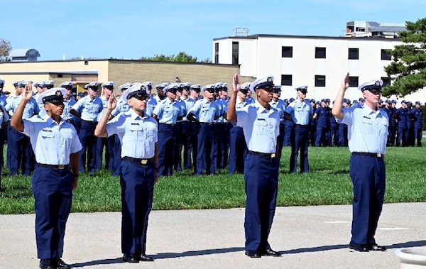 SN Oz Syla [previously known as Usman Rajkotwala, second from left] and his shipmates are sworn in as U.S. citizens during Rome-207’s graduation at Training Center (TRACEN) Cape May, October 2025 (U.S. Coast Guard Photo Courtesy of CWO Mike Lutz).