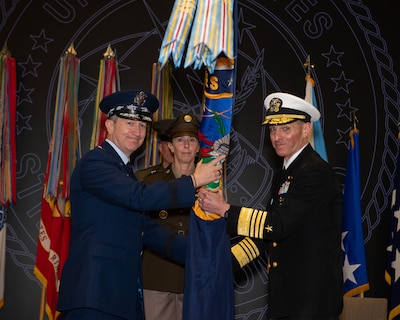Chairman of the Joint Chiefs of Staff Gen. Dan Caine presents command of U.S. Strategic Command to Adm. Rich Correll on behalf of the President during a change of command ceremony in the USSTRATCOM.