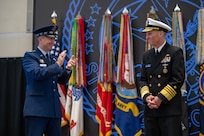 Chairman of the Joint Chiefs of Staff Gen. Dan Caine congratulates Adm. Rich Correll on his assumption of command of U.S. Strategic Command