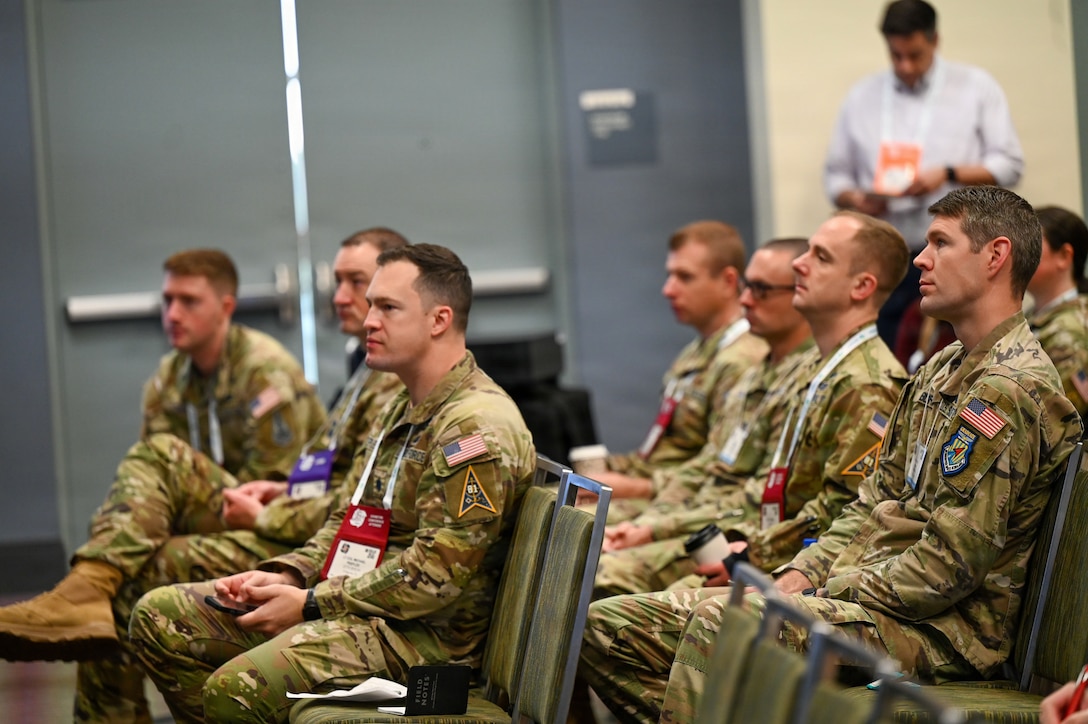 Guardians sitting in chairs in uniform