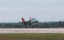 T-7A Red Hawk aircraft landing on flightline