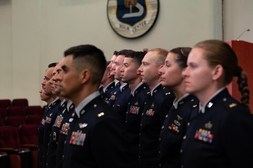 U.S. Space Force officer trainees wear their new service dress in preparation for Officer Training School graduation at Maxwell Air Force Base, Alabama, Dec. 4, 2025. One hundred officer trainees per year commission as Space Force Second Lieutenants through OTS, and 17 Guardians graduated in this week’s iteration of new officers.
