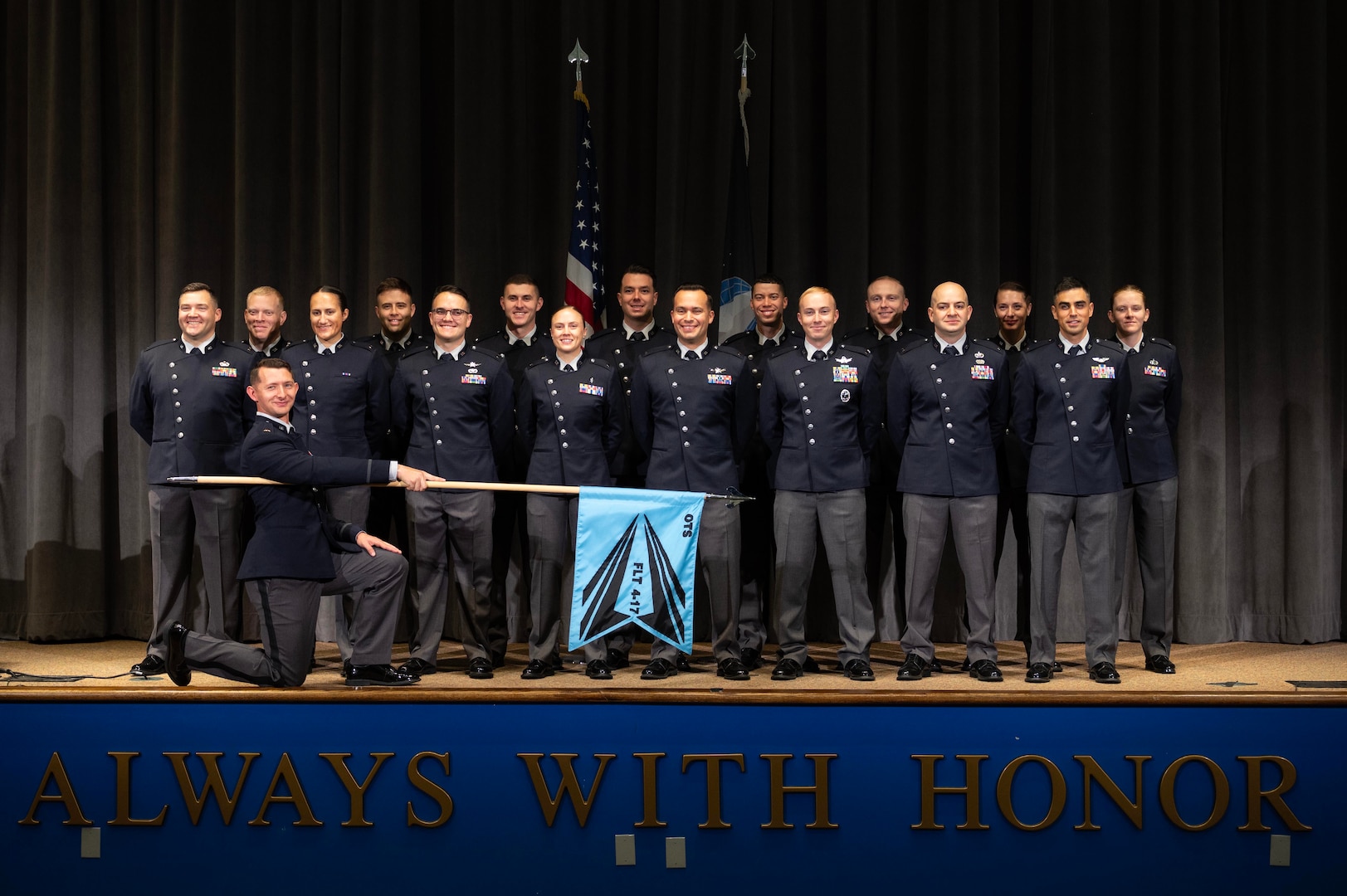 U.S. Space Force officer trainees wear their new service dress for a class photo in preparation for Officer Training School graduation at Maxwell Air Force Base, Alabama, Dec. 4, 2025. The dawn of a new era in military service unfolds as the first newly commissioned U.S. Space Force Guardians to wear the service’s new dress uniforms graduated from OTS, symbolizing a significant milestone in the evolution of the U.S. Space Force.