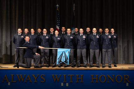 U.S. Space Force officer trainees wear their new service dress for a class photo in preparation for Officer Training School graduation at Maxwell Air Force Base, Alabama, Dec. 4, 2025. The dawn of a new era in military service unfolds as the first newly commissioned U.S. Space Force Guardians to wear the service’s new dress uniforms graduated from OTS, symbolizing a significant milestone in the evolution of the U.S. Space Force.