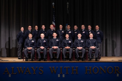 U.S. Space Force officer trainees wear their new service dress for a class photo in preparation for Officer Training School graduation at Maxwell Air Force Base, Alabama, Dec. 4, 2025. The dawn of a new era in military service unfolds as the first newly commissioned U.S. Space Force Guardians to wear the service’s new dress uniforms graduated from OTS, symbolizing a significant milestone in the evolution of the U.S. Space Force.