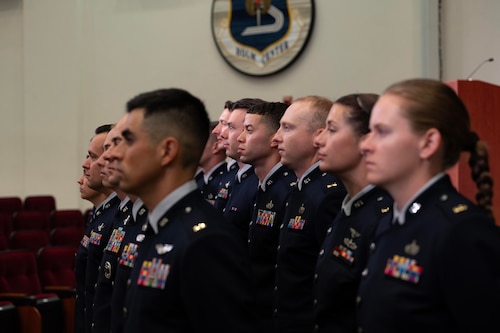 U.S. Space Force officer trainees wear their new service dress in preparation for Officer Training School graduation at Maxwell Air Force Base, Alabama, Dec. 4, 2025. One hundred officer trainees per year commission as Space Force Second Lieutenants through OTS, and 17 Guardians graduated in this week’s iteration of new officers.